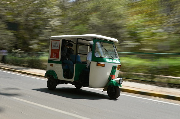An'Eleric-Auto',solar powered auto rickshaw which runs on electricity travels on a street in Bangalore on March 5, 2016.
The southern Indian city is host to the pilot project where eco-friendly conversion technology developed by RJMS Electric Vehicles Private. Ltd., makes it easy for existing autorickshaws to be easily converted to electric vehicles in a country where 20 percent of the population depends on auto rickshaws for transportation. / AFP / Manjunath Kiran        (Photo credit should read MANJUNATH KIRAN/AFP/Getty Images)